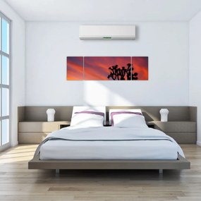 Obraz zachodu słońca nad sylwetką drzewa (170x50 cm)