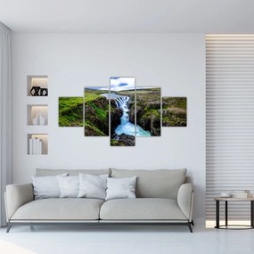 Obraz wodospadu między skałami (125x70 cm)