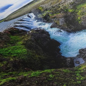Obraz wodospadu między skałami (z zegarem) (90x30 cm)