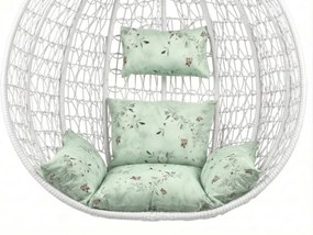 Białe wiszące krzesło KOKON ze stojakiem, jasnozielona poduszka ze wzorem