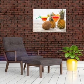 Obraz na szkle ananasów i szklanek na plaży (70x50 cm)