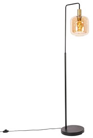 Designerska lampa podłogowa czarna z mosiądzem i bursztynowym szkłem - ZuzannaDesignerski Oswietlenie wewnetrzne