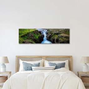 Obraz wodospadu między skałami (170x50 cm)