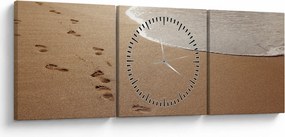 Obraz - ślady stóp na piasku i morzu (z zegarem) (90x30 cm)