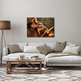 Obraz kobiety leżącej na plaży (70x50 cm)