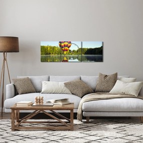Obraz balonu na ogrzane powietrze nad jeziorem (z zegarem) (90x30 cm)
