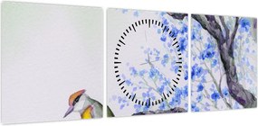 Obraz - ptak na drzewie z niebieskimi kwiatami (z zegarem) (90x30 cm)