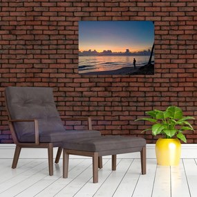Obraz na szkle - kobieta na plaży (70x50 cm)