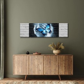 Obraz niebieskiego motyla na ścianie (170x50 cm)