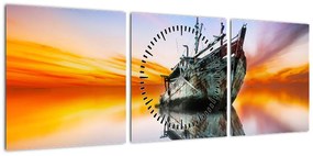 Obraz - Wschód słońca nad wrakiem łodzi (z zegarem) (90x30 cm)
