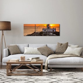 Obraz latarni morskiej o zachodzie słońca (z zegarem) (90x30 cm)