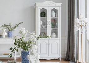 Biały regał do salonu Beatrice, wymiary 98x43x223 cm. Przeszklone fronty, wewnątrz półki. Białe angielskie meble Victoria.