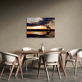 Obraz na szkle - Jeździec na koniu o zachodzie słońca (70x50 cm)