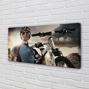 Obraz drukowany na płótnie Rowerzysta na Tle Chmur