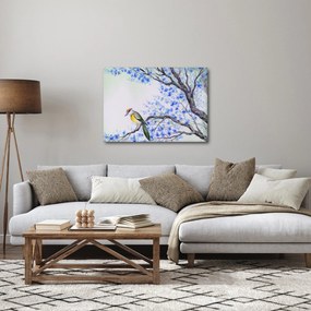 Obraz - ptak na drzewie z niebieskimi kwiatami (70x50 cm)