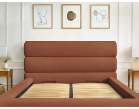 Pomarańczowe tapicerowane łóżko dwuosobowe ze schowkiem i stelażem 180x200 cm Jagna – Bobochic Paris