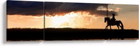 Obraz - Jeździec na koniu o zachodzie słońca (170x50 cm)