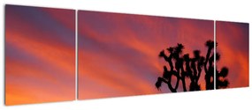 Obraz zachodu słońca nad sylwetką drzewa (170x50 cm)