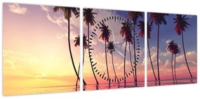 Obraz palm wznoszących się nad powierzchnią (z zegarem) (90x30 cm)