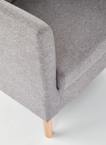 Tapicerowany fotel na drewnianych nóżkach Clubby