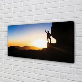 Obraz drukowany na płótnie Człowiek w Górach o Zachodzie