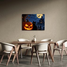 Obraz - Czarny kot przy świecącej dyni na Halloween (70x50 cm)