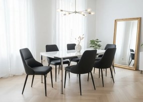 Eleganckie czarne krzesło Monolit tapicerowane ekoskórą PU, wygodne, nowoczesne i idealne do jadalni lub biura. Smukłe metalowe nogi dodają mu lekkości i stylu.