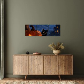 Obraz - Czarny kot przy świecącej dyni na Halloween (z zegarem) (90x30 cm)