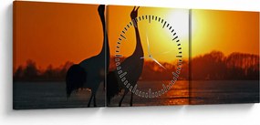 Obraz ptaków o zachodzie słońca (z zegarem) (90x30 cm)