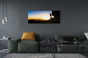 Obraz drukowany na płótnie Człowiek w Górach o Zachodzie