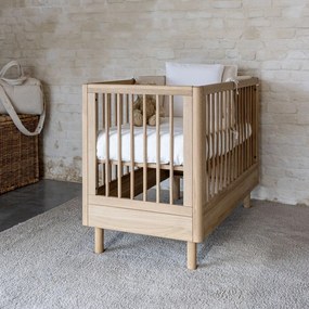 Łóżeczko z litego drewna dębowego z regulowaną wysokością 60x120 cm w naturalnym kolorze Forrest – Vipack