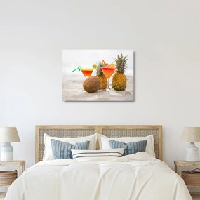 Obraz na szkle ananasów i szklanek na plaży (70x50 cm)