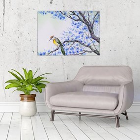 Obraz - ptak na drzewie z niebieskimi kwiatami (70x50 cm)