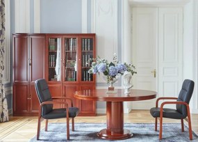 Elegancki stół biurowy o okrągłym blacie Conference. Dwa rozmiary średnicy do wyboru: 90 cm i 120 cm. Stół fornirowany drewnem w odcieniu koniaku, okrągła podstawa, stylowe wykończenie.