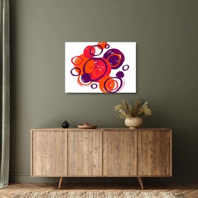 Obraz na szkle - Motyw z kółkami w ciepłych kolorach (70x50 cm)