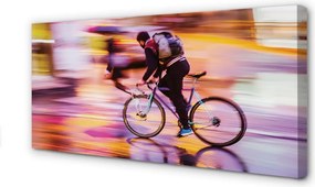 Obraz canvas na ścianę Rowerzysta w Blasku Świateł