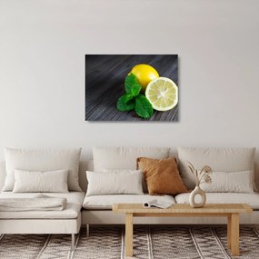 Obraz na szkle - cytryn i mięty na stole (70x50 cm)