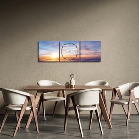 Obraz - Zachód słońca ponad chmurami (z zegarem) (90x30 cm)