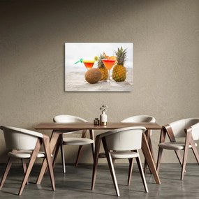 Obraz na szkle ananasów i szklanek na plaży (70x50 cm)