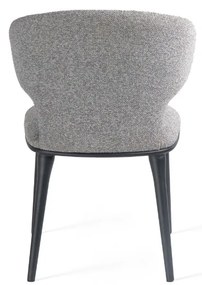 Stylowe krzesło Serene, które łączy miękką tkaninę  z wygodą i solidnym wykonaniem, idealne do wnętrz z charakterem.