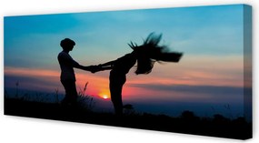 Fotoobraz na płótnie Ludzie na Tle Zachodu Nieba