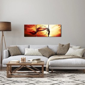 Obraz - Sylwetka kobiety o zachodzie słońca (z zegarem) (90x30 cm)