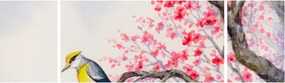 Obraz - ptak na drzewie z czerwonymi kwiatami (170x50 cm)